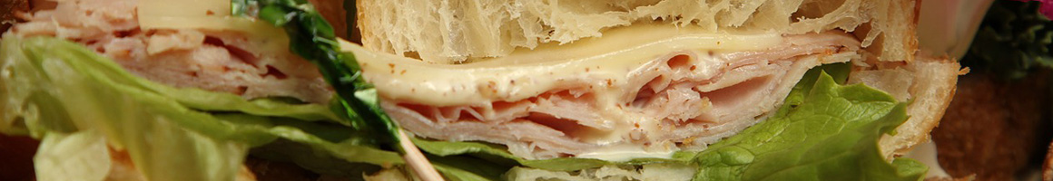 Eating Deli Sandwich at Longfellow's Sandwich Deli restaurant in Morristown, NJ.